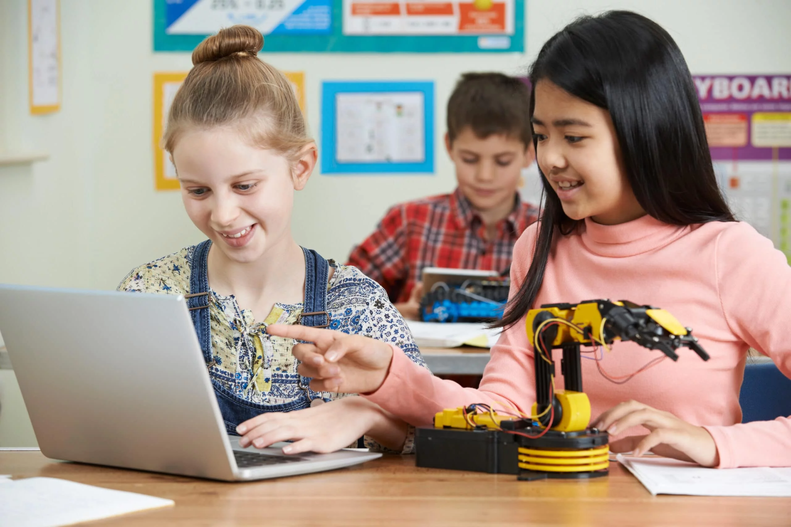 Female Pupils In Science Lesson Studying Robotics